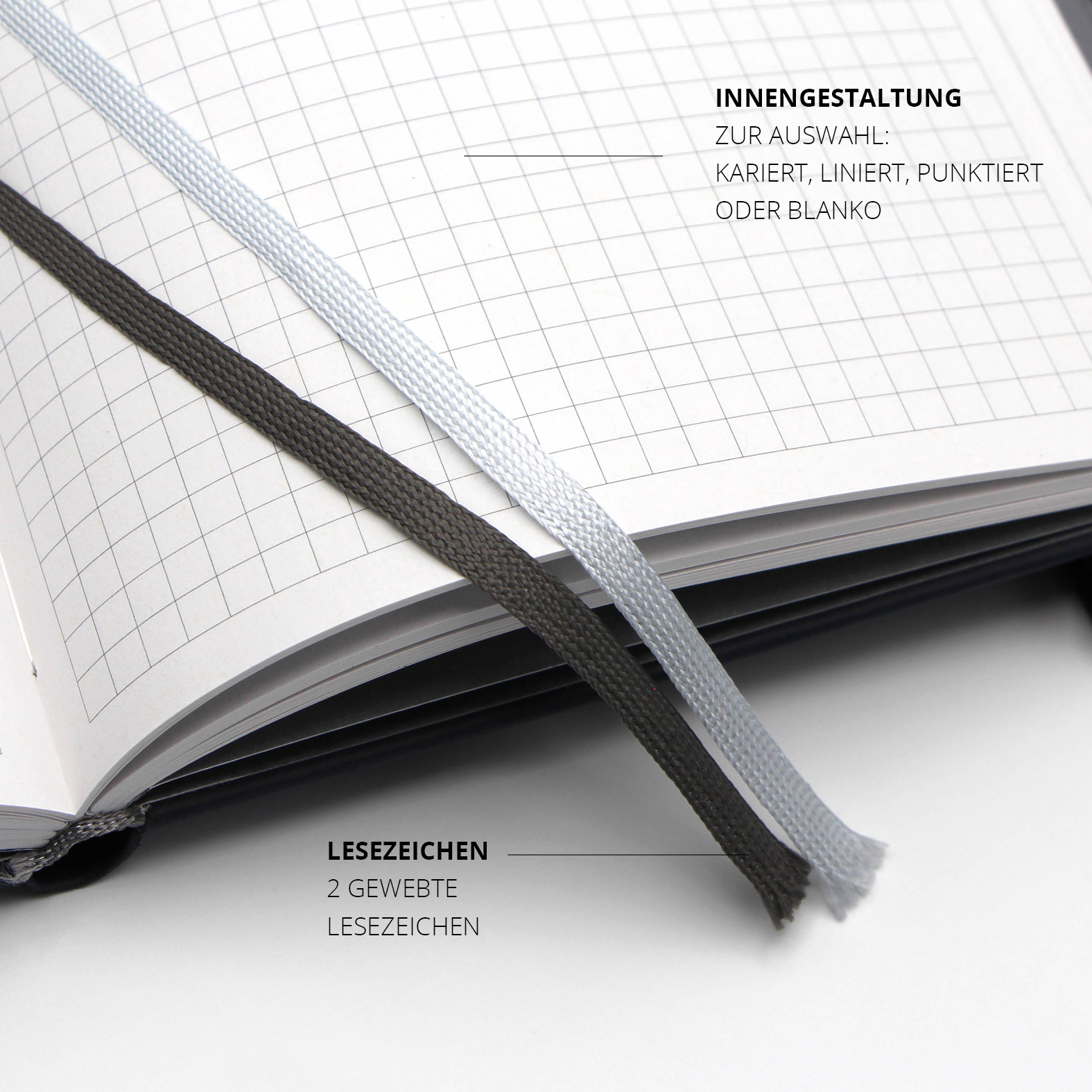 Zwei gewebte Lesezeichen in Weiß und Schwarz ermöglichen schnelles Finden wichtiger Seiten im Lanybook® Nature Notizbuch.